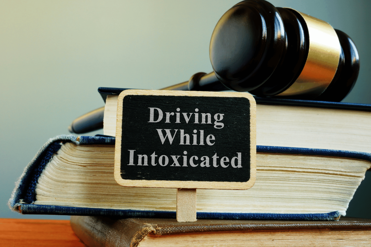 driving while intoxicated label in front of law books