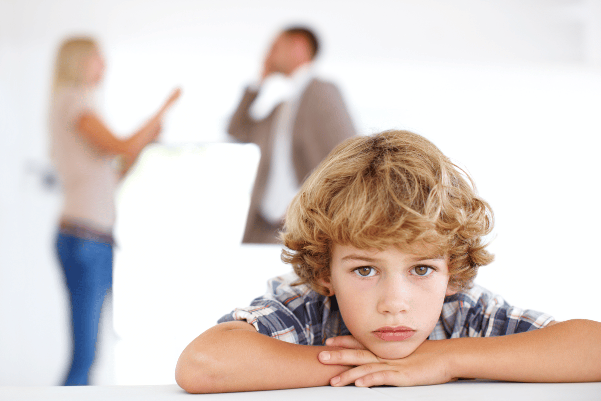 parents arguing in background while child remains neglected